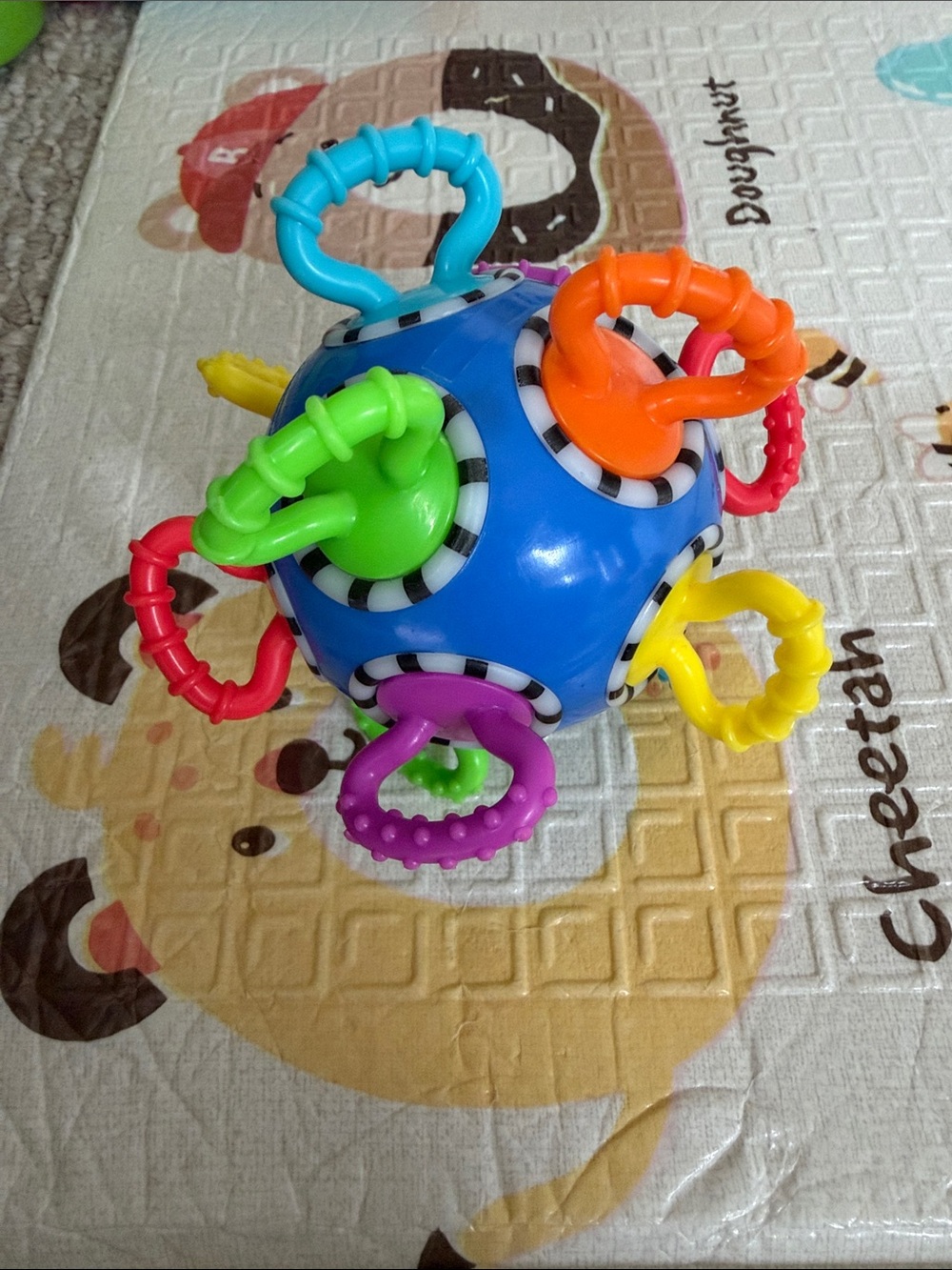 Manhattan Toy Company Click Clack Ball - Bright Blue with Multicolor Rings